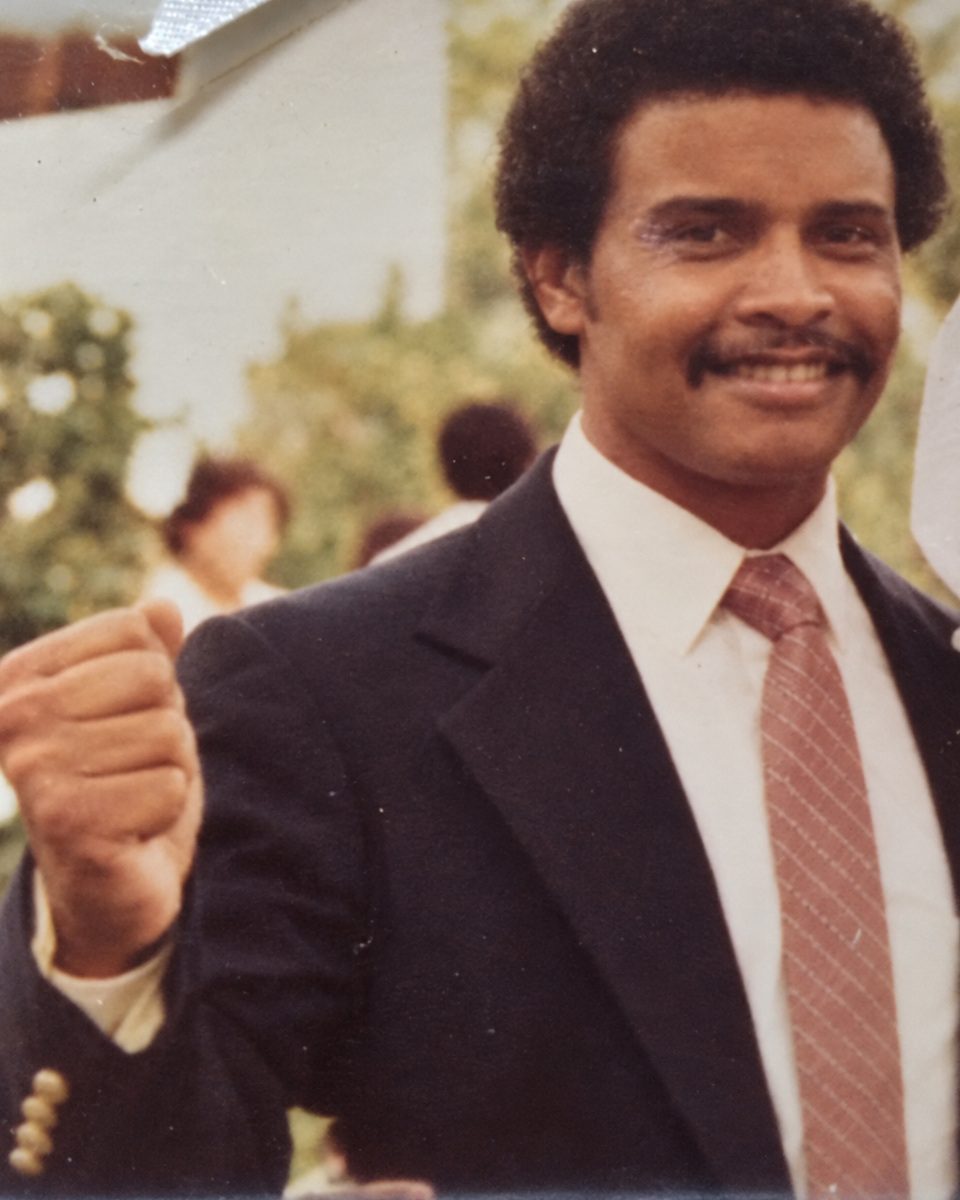 Sidney Strickland with a raised fist