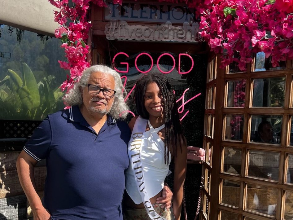 Sidney Strickland with his granddaughter